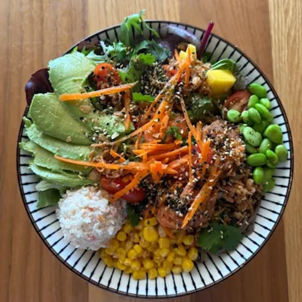 Toro Sushi Poke House's colorful poke bowl with avocado, edamame, corn, and shredded carrots.